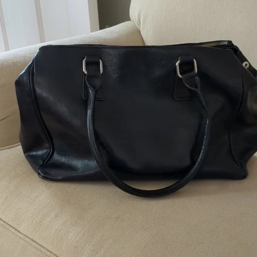 Floto hard leather purse